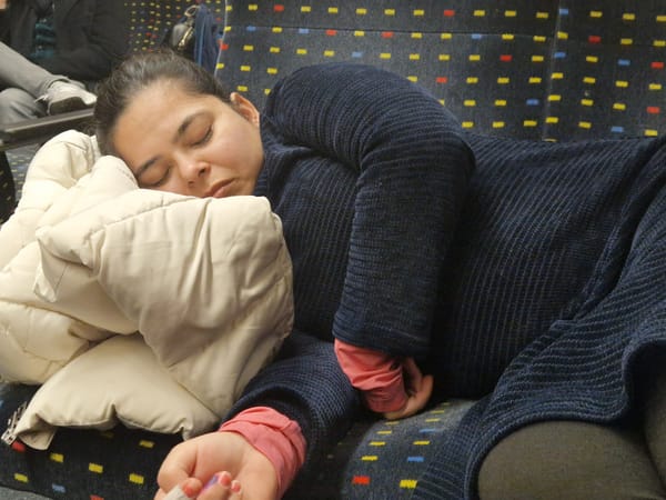 My partner sleeping in the train